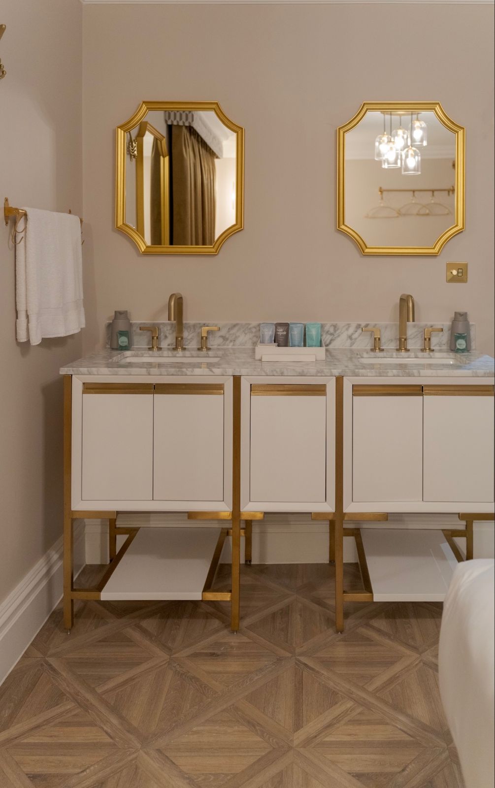 Marble basins with brushed brass taps