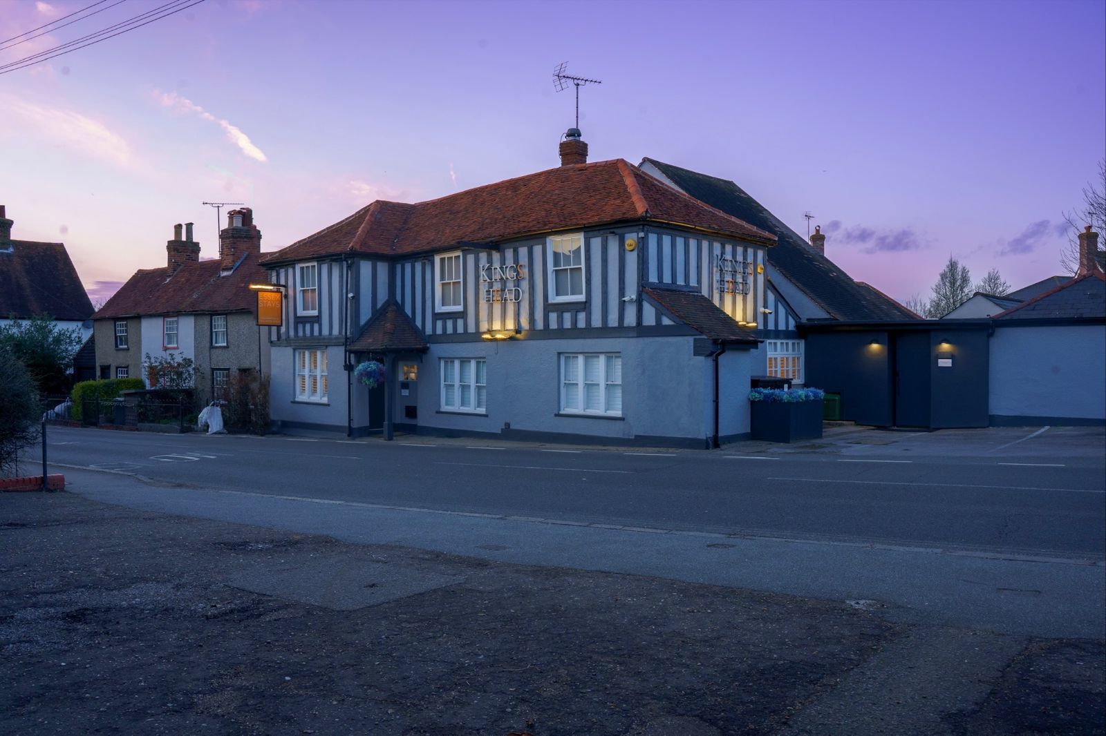 The Kings Head at dusk, a timber-framed former inn on Maldon Road, Great Baddow